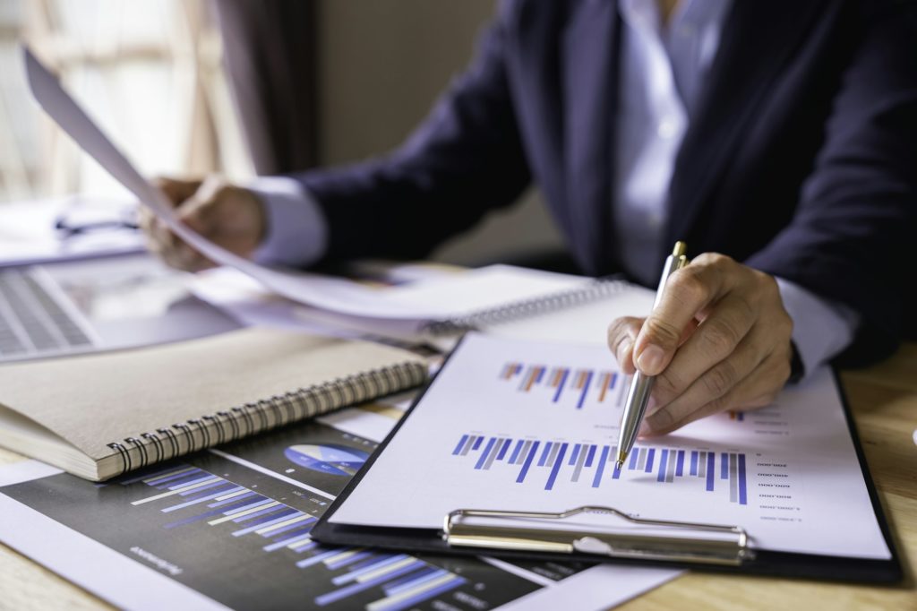 Businessman Accounting Calculating Cost Economic Financial data, taxes, bank account balance and cal