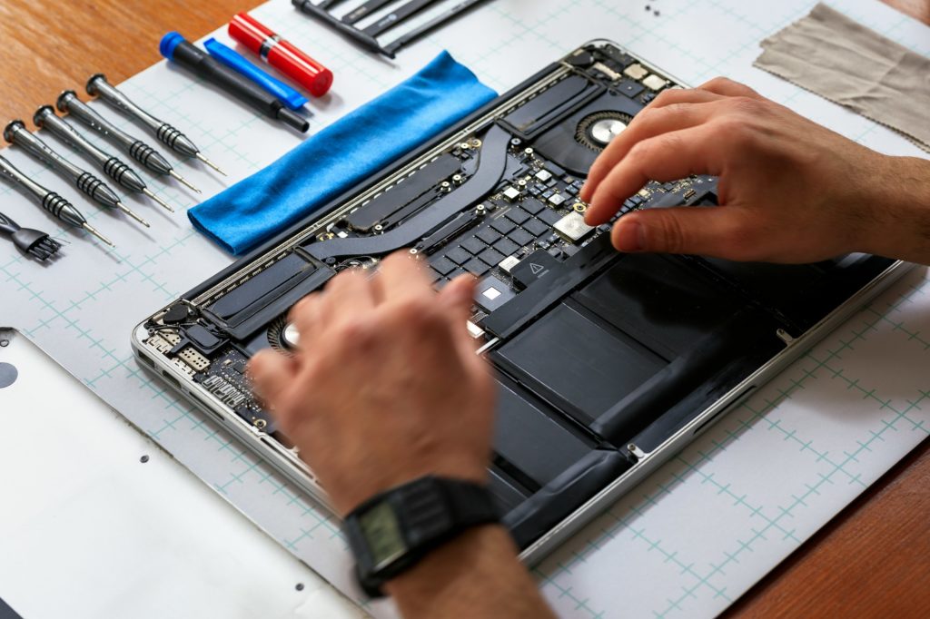 Computer technician fixing a PC