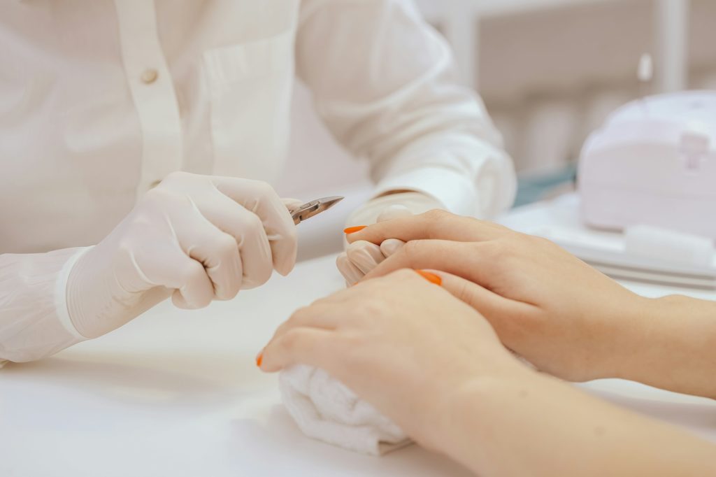 Manicurist does manicure