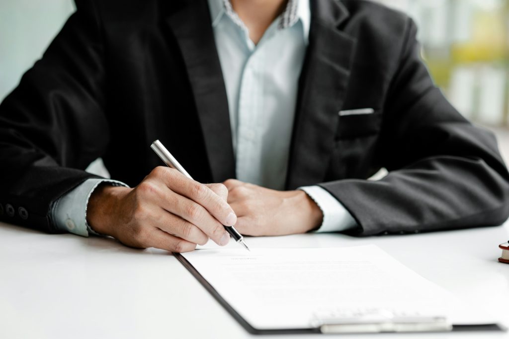 Real estate agents are drafting sales contracts for customers.